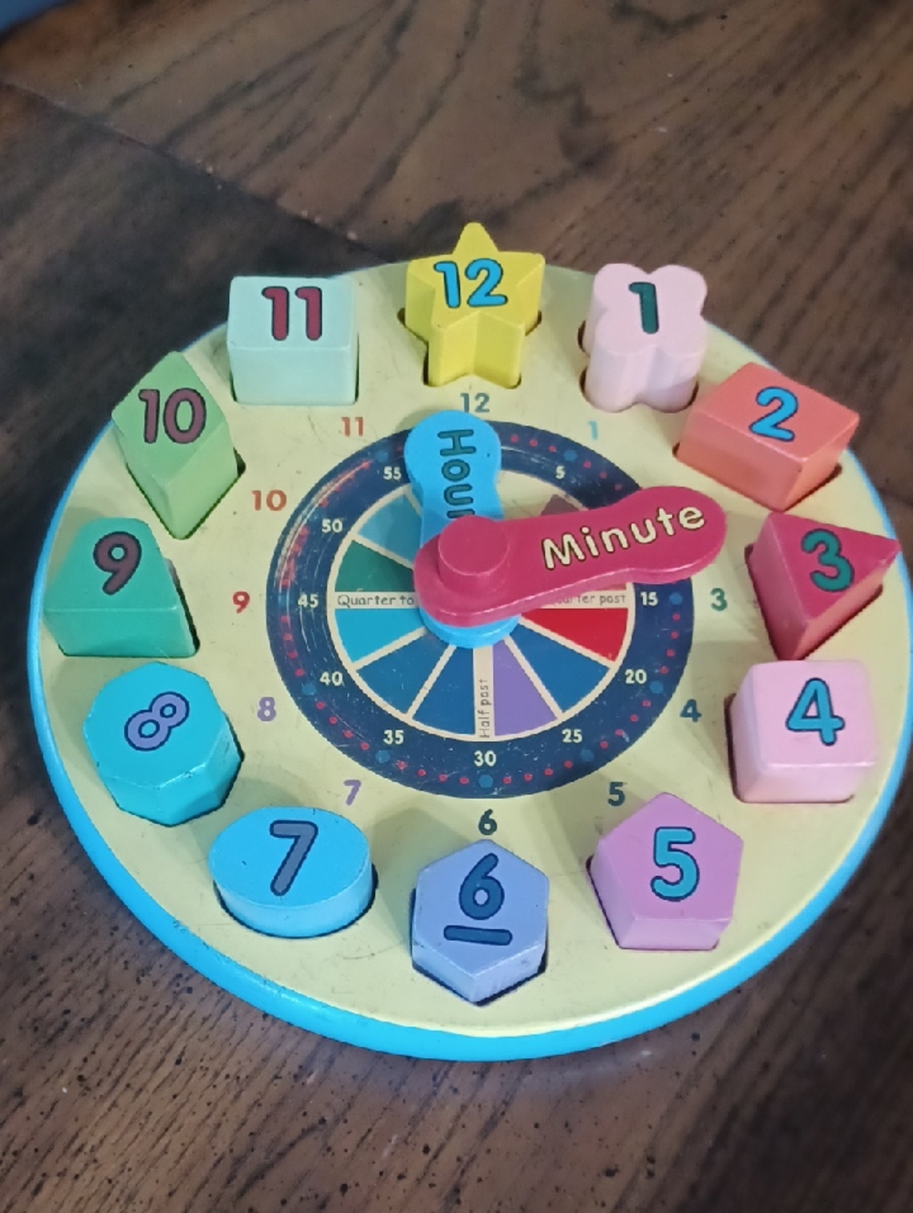 Melissa & Doug Wooden Clock Puzzle in Yellow, Blue, Pink, Green, Red, Purple